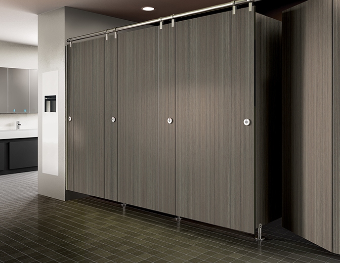 Global toilet partitions being displayed in a commercial restroom.
